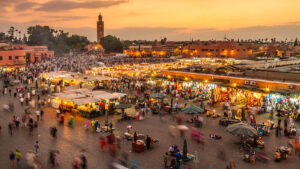 Jamaa el Fna market square in sunset, Marrakesh, Morocco, north Africa. Jemaa el-Fnaa, Djema el-Fna or Djemaa el-Fnaa is a famous square and market place in Marrakesh`s medina quarter.