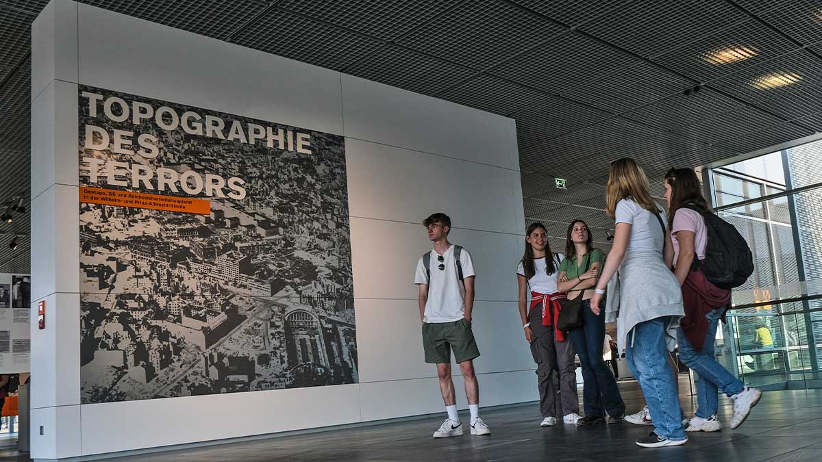 School group on a History Tour posing at the Topographie of Terror museum in Berlin