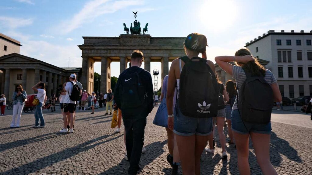 School group on a History Tour in Berlin walking towards the Brandenburg Gate
