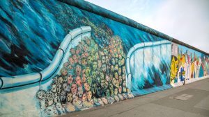 Visit the East Side Gallery, as part of a school history trip to Berlin