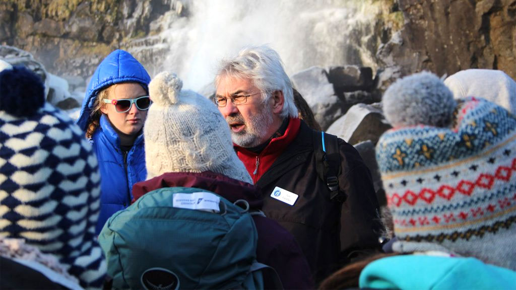 Geography Field Study Tutor talking to students on a trip to Iceland