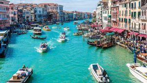 Boats sailing down the canal in Venice