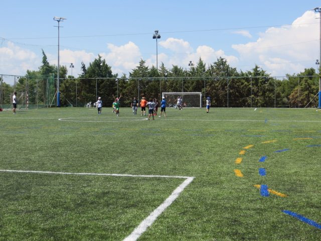 Childs football team celebrating goal