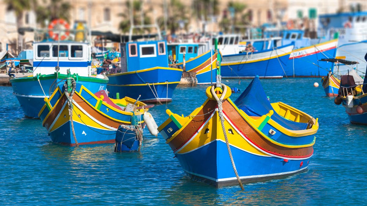 Colourful boats on the water in Malta