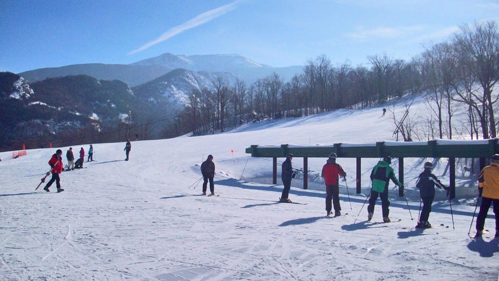 Skiers enjoying the slopes of Cannon