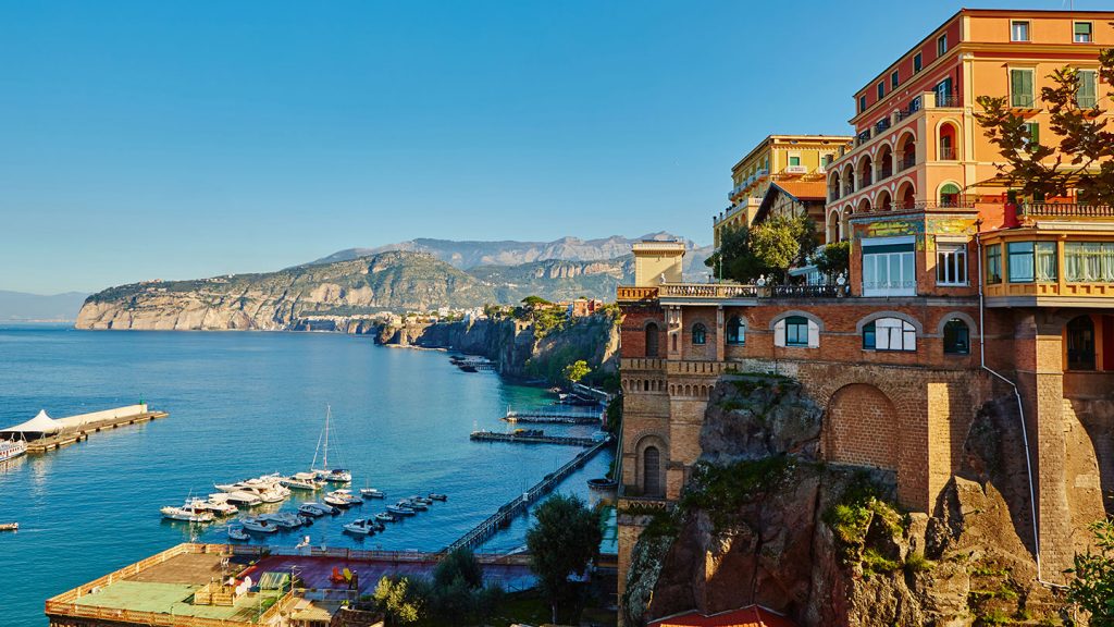 Rocky coastline of Sorrento town overlooking the docks