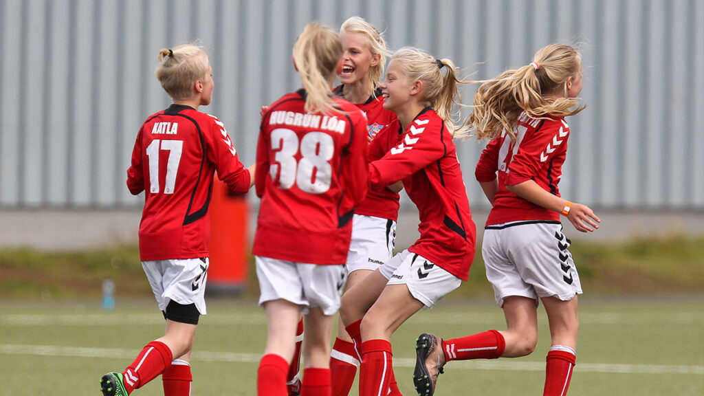 A team celebrating about scoring a goal at the Rey Cup Football Tournament in Iceland