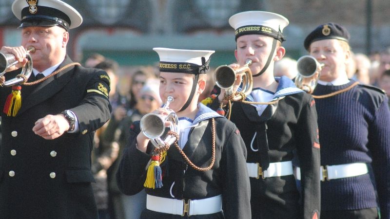 A marching band performing on the streets of Belgium