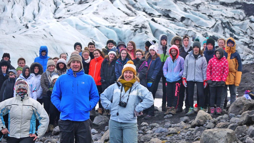 Group of students against scenery of Iceland on a Geography School Trip