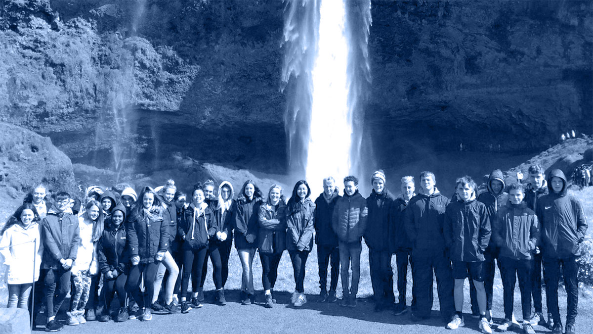 St Ivo Academy group standing in front of a waterfall in Iceland 2019