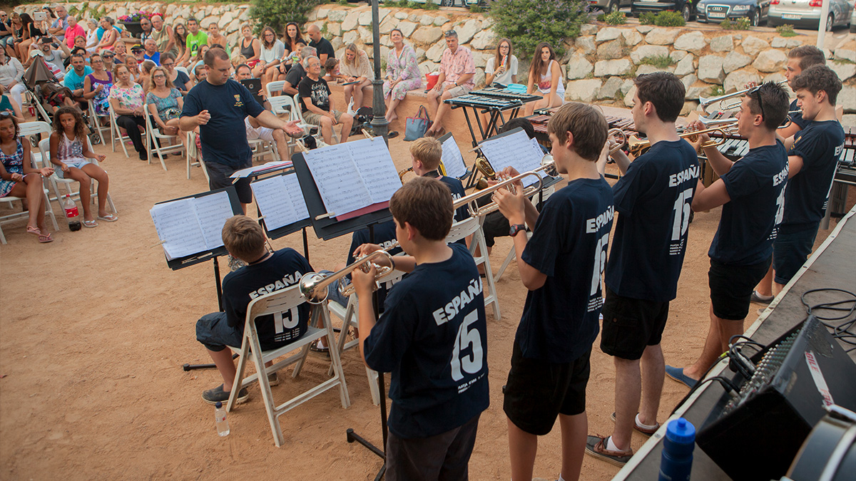 St Benedicts performing music outdoors in Costa Brava during their concert tour