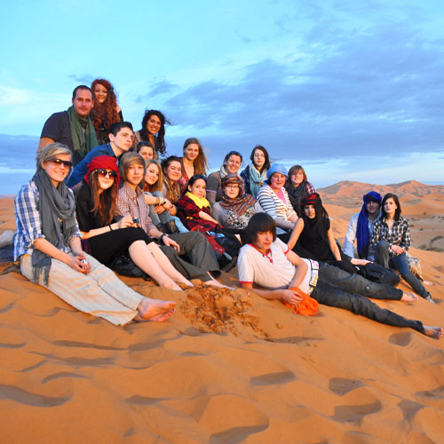 School pupils on sand dunes in Morocco