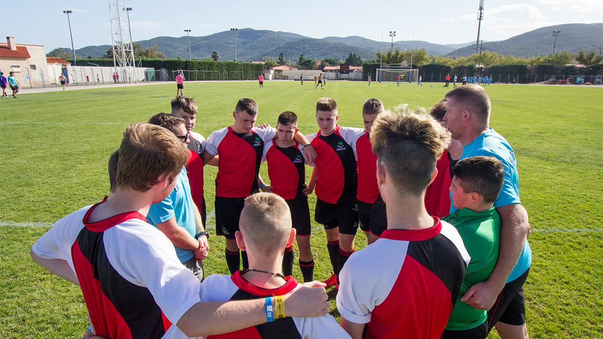 Football players huddle