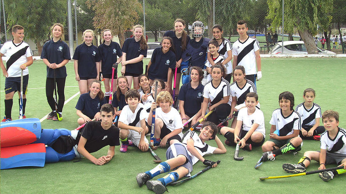 Hockey team of boys and girls pose for the camera