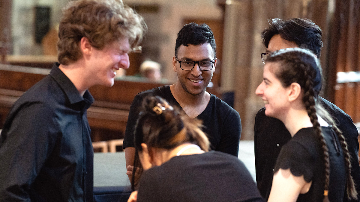 9 top tips on how to plan the perfect school concert tour: group of students laughing during a break