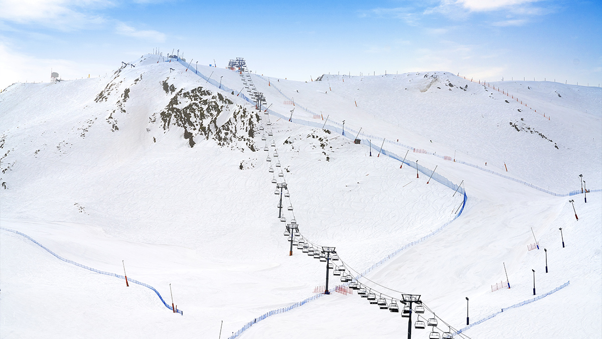 Grandvalira: Andorra’s Paradise Ski Resort - ski slopes with ski lifts over the top on a snowy mountain