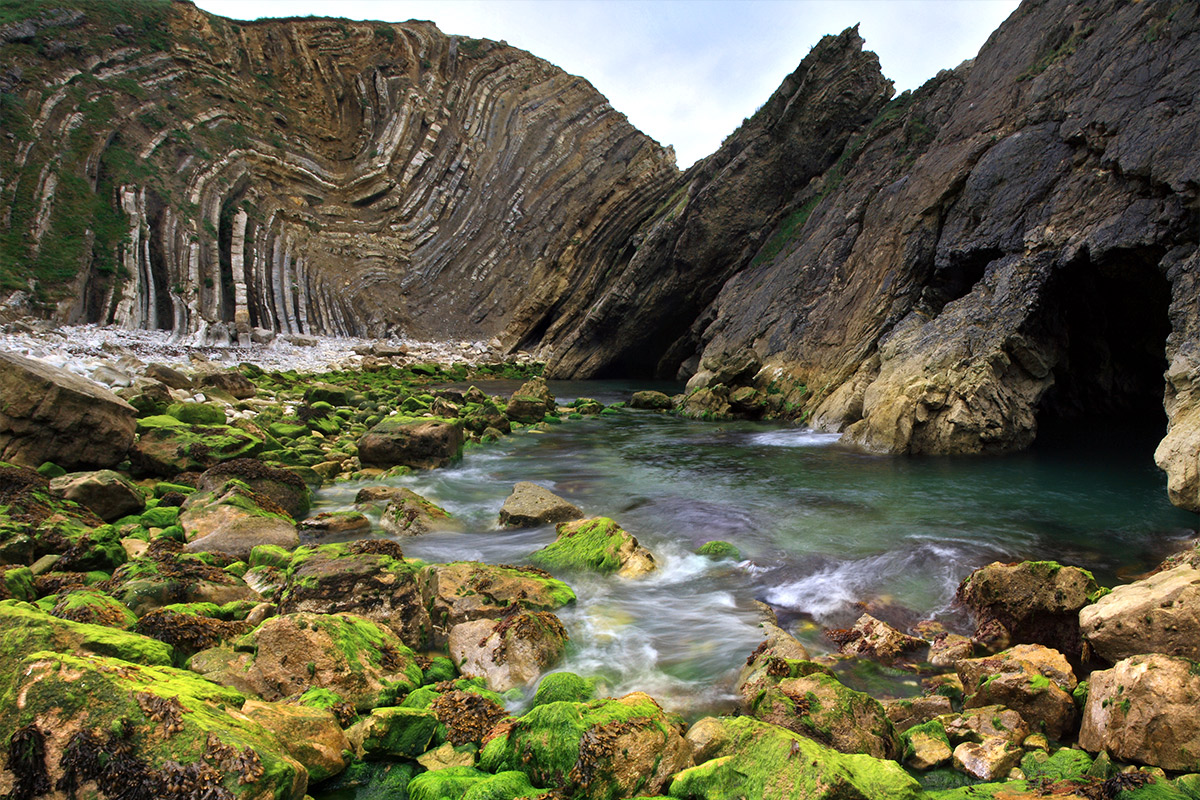 A view from down on the Stair Hole at the famous Lulworth Cove from Dorset