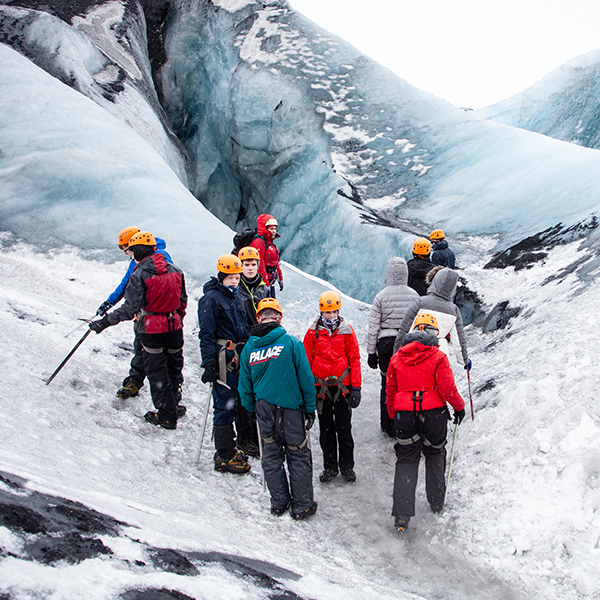 School tour hikes a glacier on an image in the blog 4 Reasons and 4 Affordable Tips for Your School Tour 