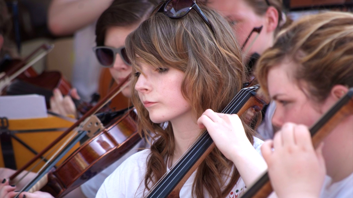 Youth concert performers from part of an orchestra