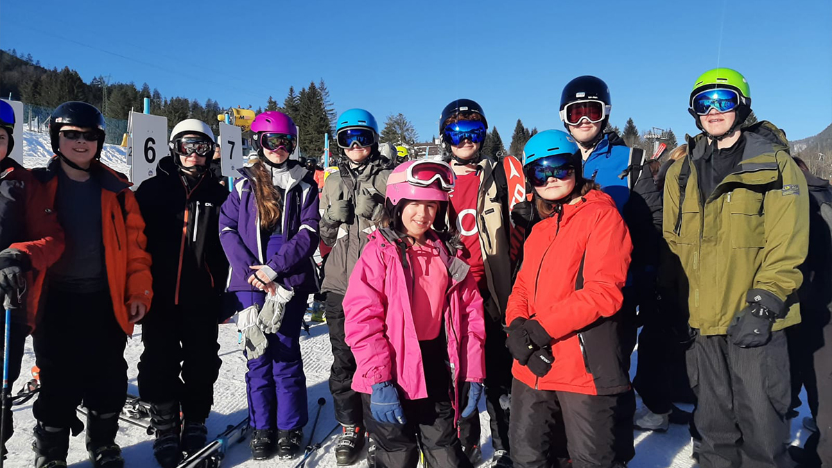 A group of young skiers posing for a photograph in Tarvisio, Italy in the February half-term ski season 2023