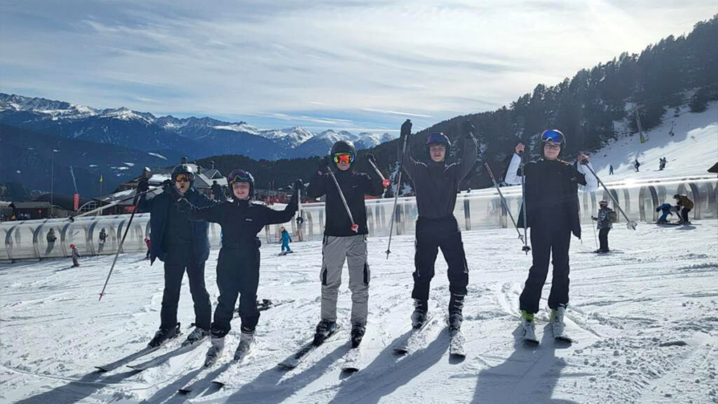 Young skiers posing on the slopes of Vallnord, Andorra