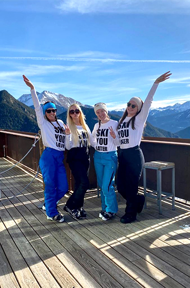 4 teachers posing with a mountain view in Vallnord, Andorra from the February half-term ski season 2023
