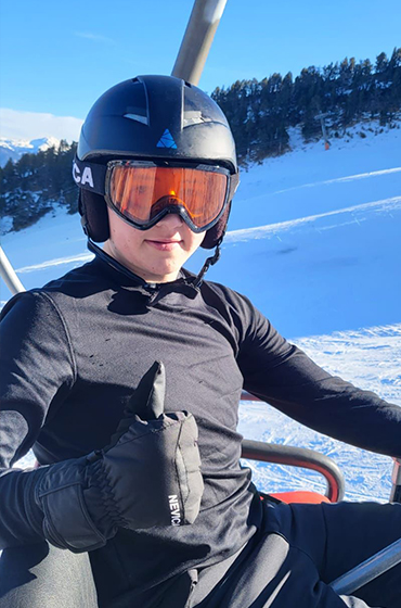 A young skier on a ski lift in Vallnord, Andorra from the February half-term ski season 2023