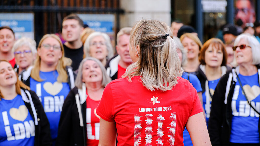 Choir Leader leads choristers in the Got 2 Sing London Tour 2023