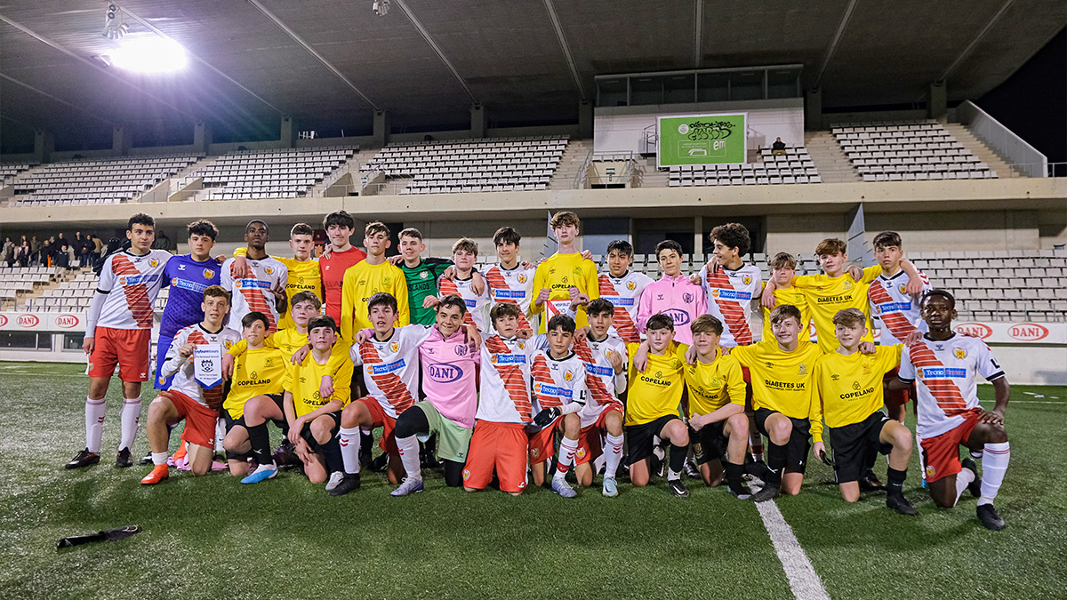 a UK Barcelona School Football Tour poses with the local Spanish side they played against