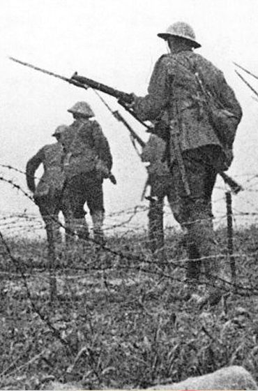 A grainy, grey and white photo of solders walking with rifles and bayonets at hand on the Explore History Hub