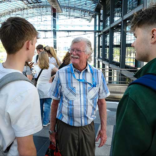 History Tour Guide Trevor Booker chats with two students whilst out on tour