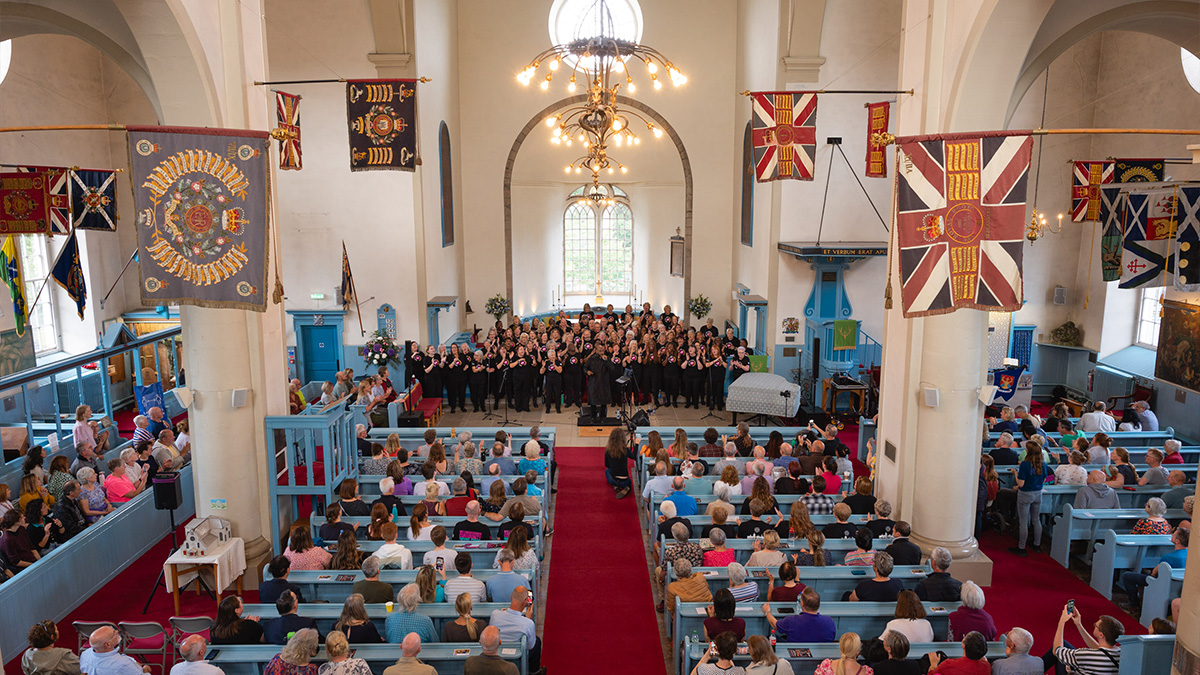 Wellingborough Community Gospel Choir performing inside Canongate Kirk in Edinburgh during the Fringe Festival