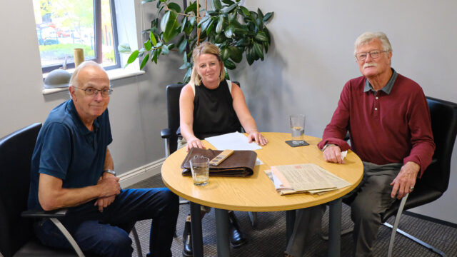 Nicky Astle, Rayburn Tours Marketing Manager, sits with History Tour Guides Trevor Booker and Tony Smith before a historic podcast