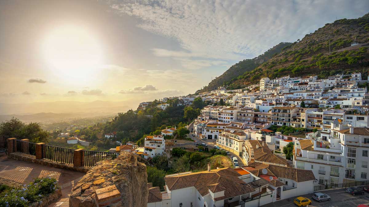 Sun sets on an Andalusian coastal white building town