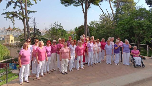 Caritas Harmony pose for the camera on their concert tour with Barcelona in the background
