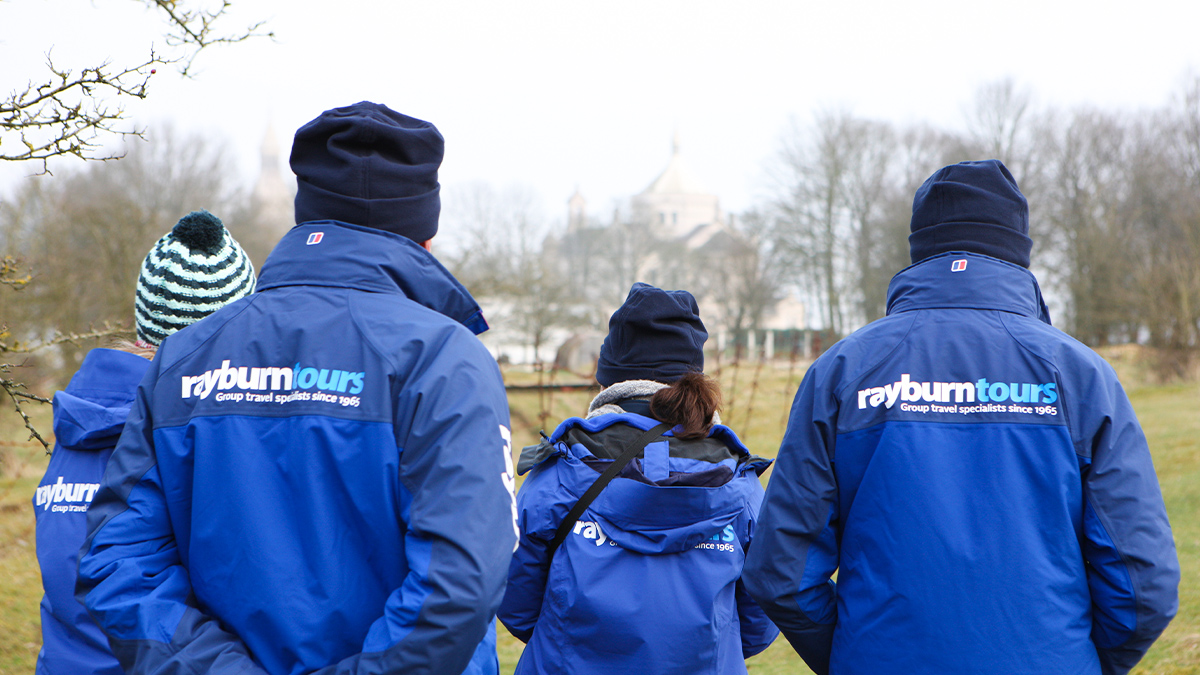 Rayburn tours guides with a Rayburn Tours coat