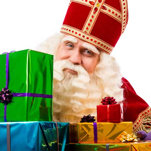 Sinterklaas with gifts . A typical Dutch character of st.Nicholas and Zwarte Piet is one of the Christmas traditions from around the world.