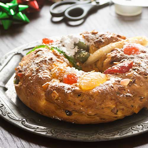 Bolo do Rei or King s Cake is a ring shaped cake with candied fruit served in Portugal around Christmas and is one of the Christmas traditions from around the world.