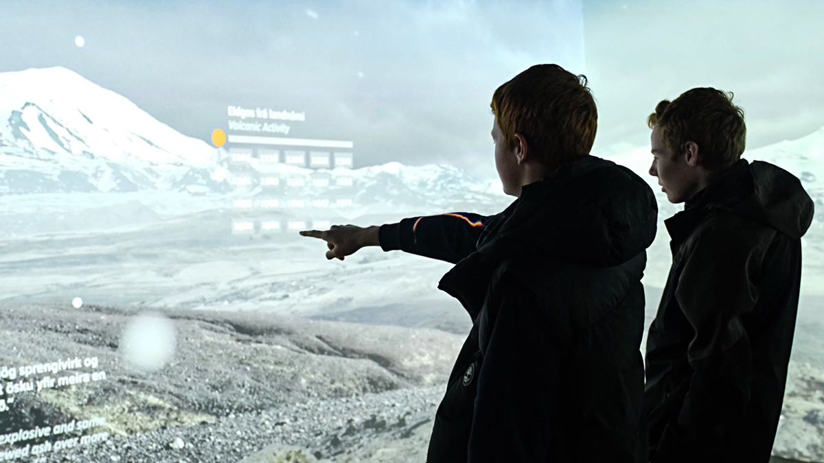 Students engage with an interactive wall in the Lava Centre in Iceland.