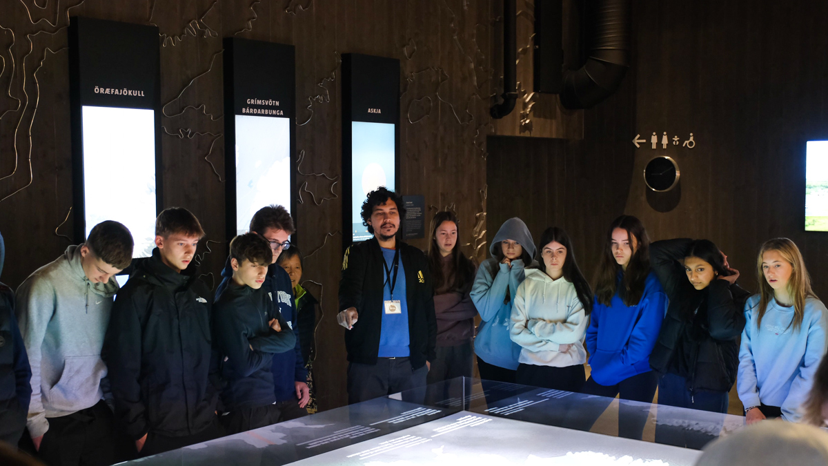 Students listen to the guide at the Lava Centre in Iceland.