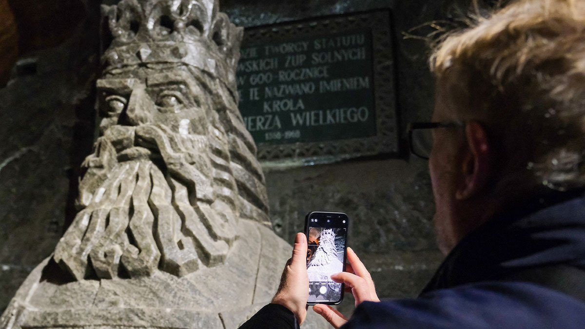 Person taking a photo in the Wieliczka Salt Mine