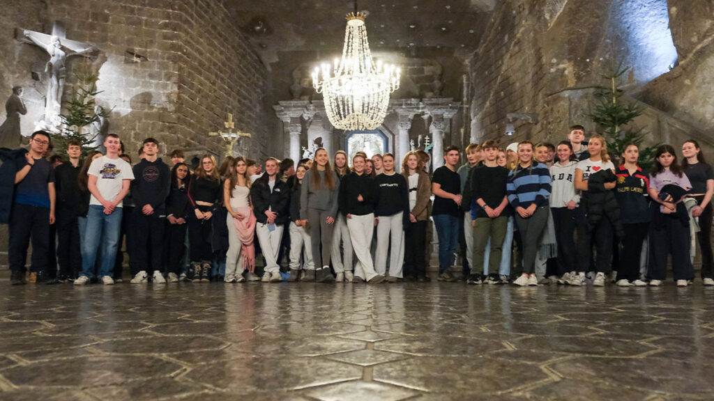 School students pose for a group photo at the Wieliczka Salt Mine in Krakow