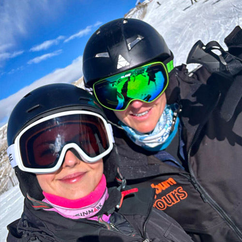 Rayburn Ski Reps take a selfie, with slopes in the background.