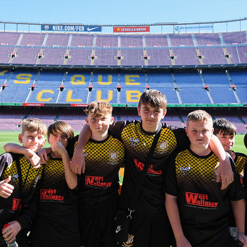 Students posing for a photo at Nou Camp Football Stadium in Barcelona Spain