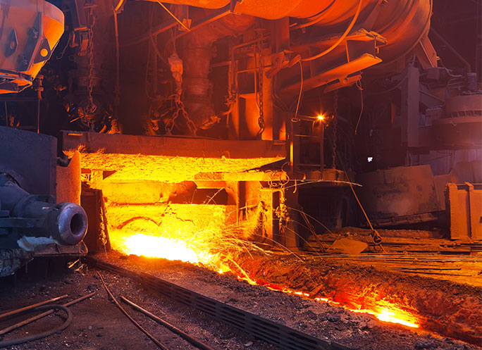 Close view of working blast furnace at the metallurgical plant