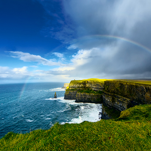View of Ireland with rainbow and sea