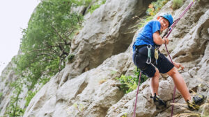 abseiling down cliff