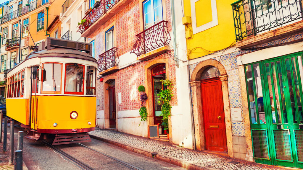 Yellow vintage tram on the street in Lisbon, Portugal. Famous travel destination