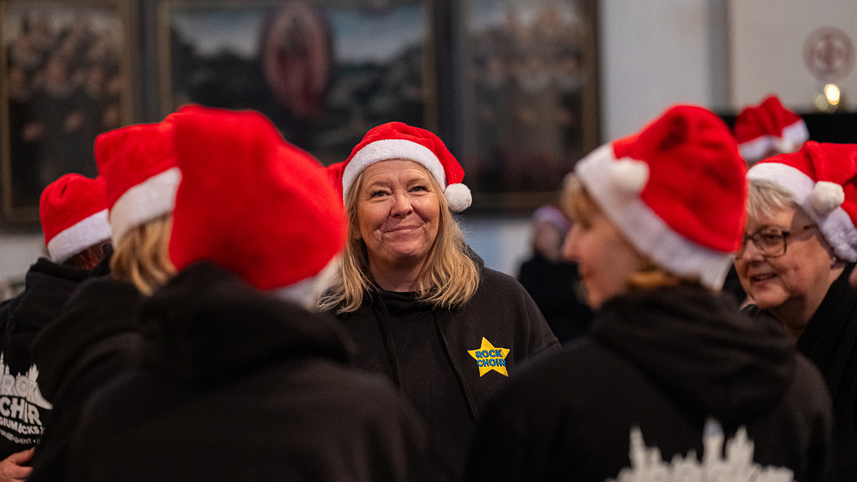 Rock choir members chatting amongst eachother