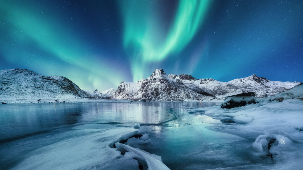 Aurora Borealis, Lofoten islands, Norway. Nothen light, mountains and ocean. Winter landscape at the night time.